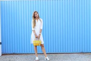 White dress, blue wall